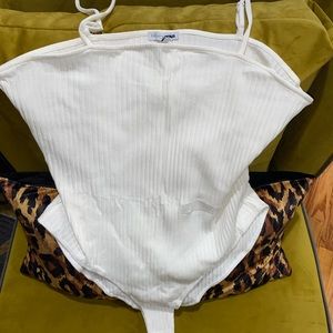 Fashion Nova Black and White bodysuits.